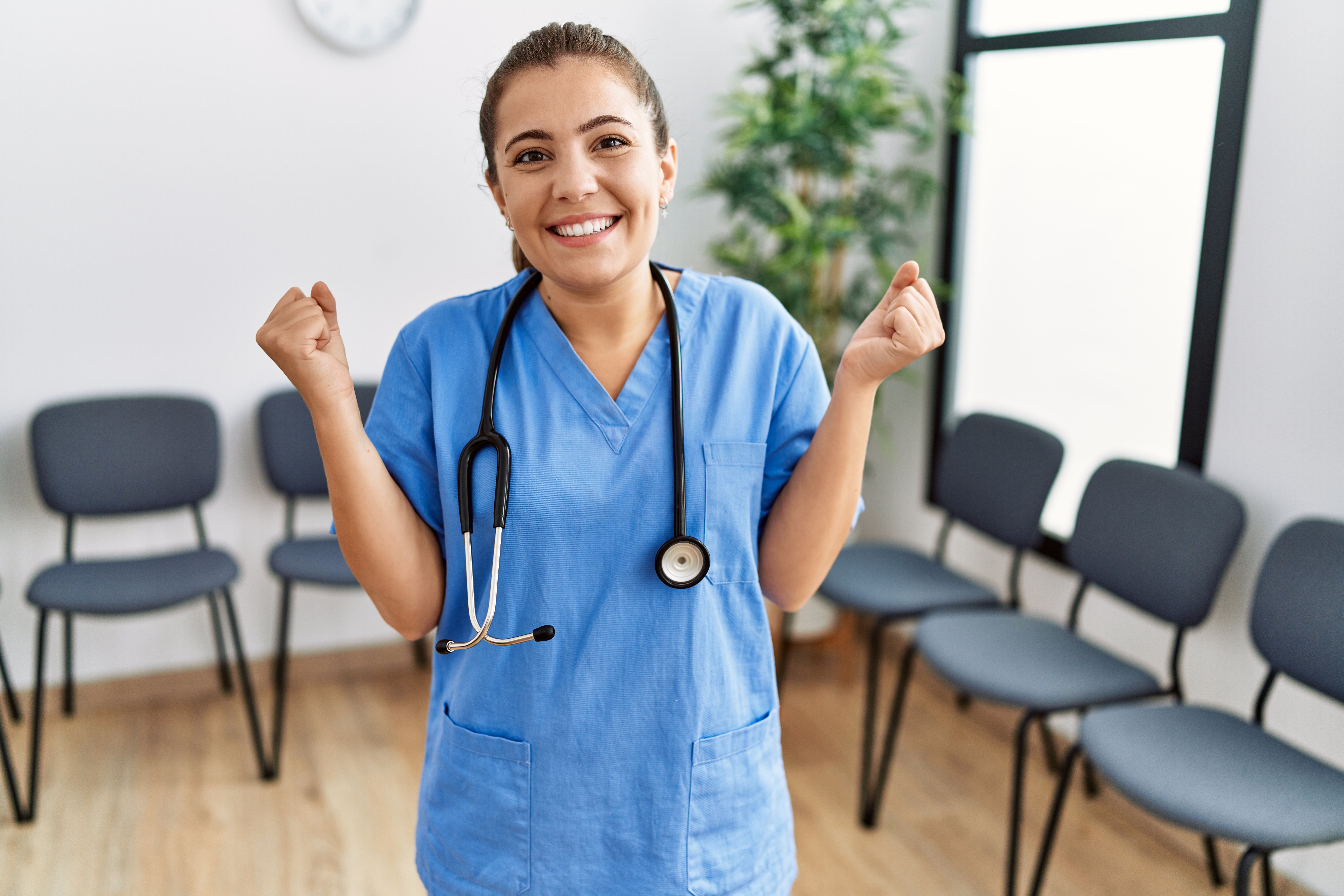 Young,Brunette,Doctor,Woman,At,Waiting,Room,Screaming,Proud,,Celebrating